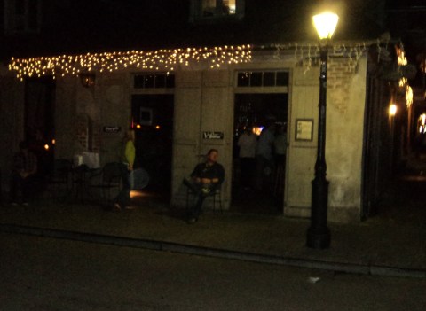 That's me sitting under the street light outside America's oldest pub